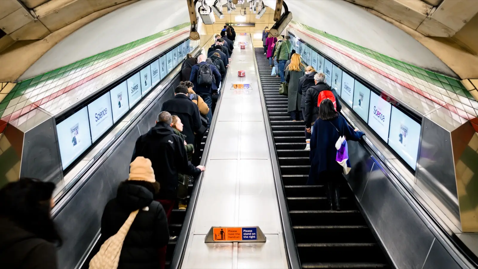 Digital ribbon advertising along an Underground escalator