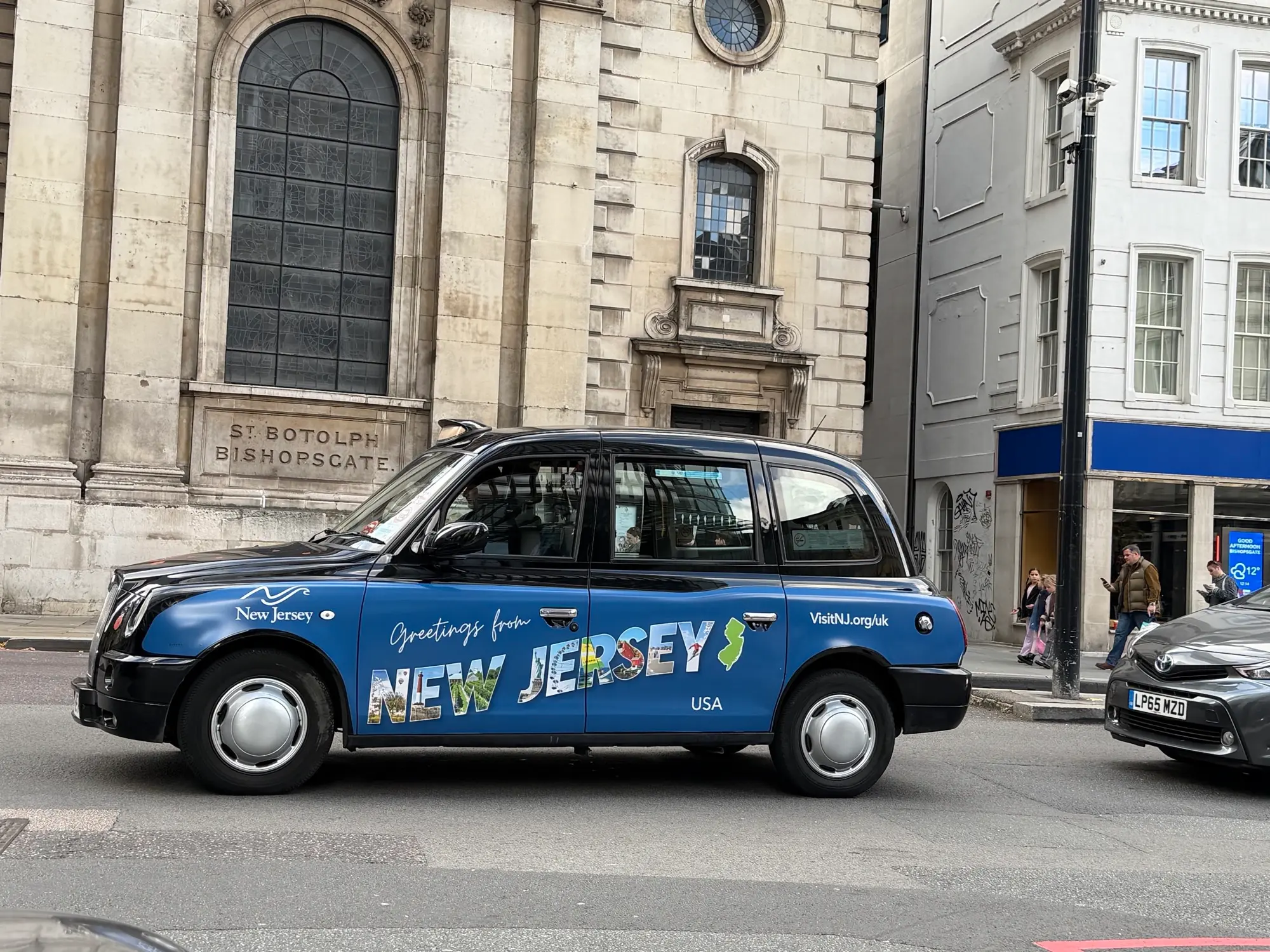 London black cab with superside advertising wrap
