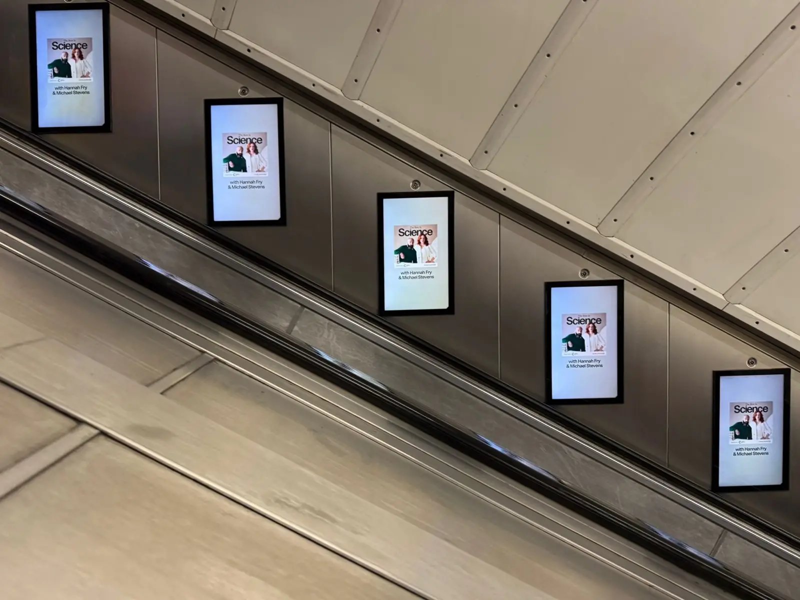 Digital escalator panel advertising on the Underground