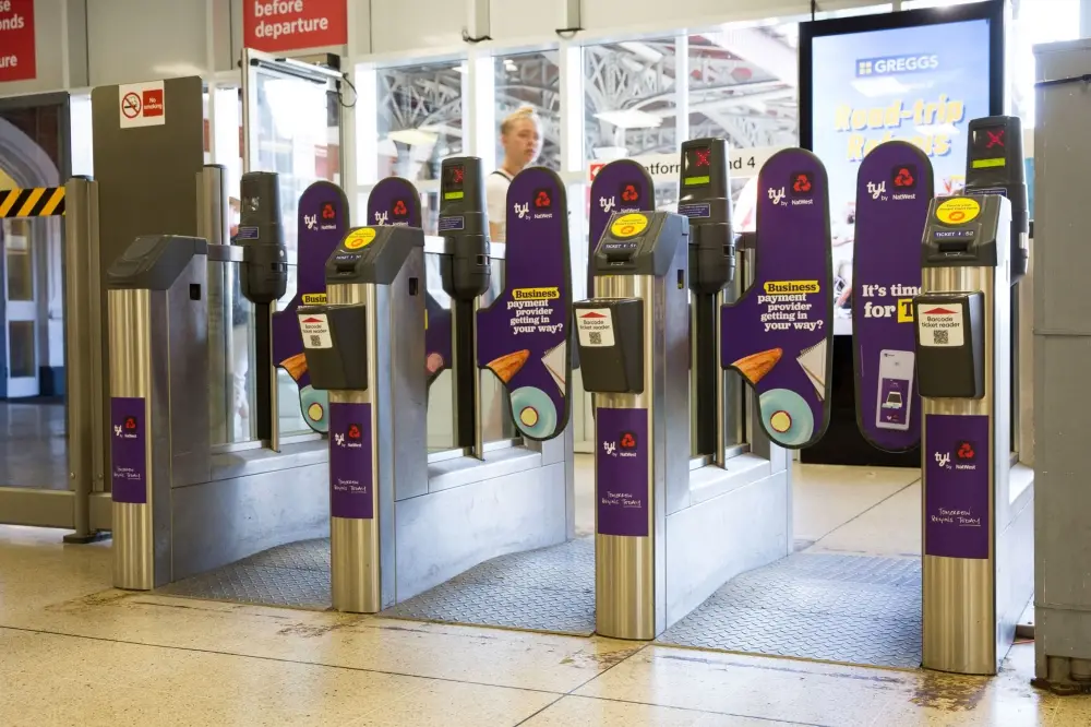 Branded ticket gateway barriers in a London Underground station